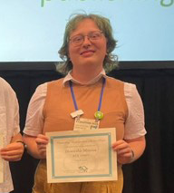Ren Horn with award certificate